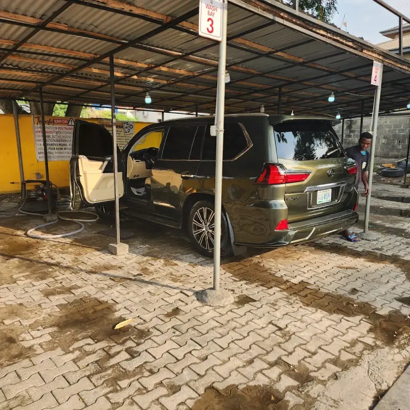 Car parked under the canopy with door open